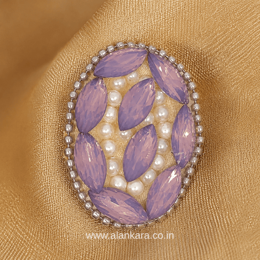 Lavender Crystal Pearl Saree Pin featuring sparkling crystals and delicate pearls on a golden fabric.
