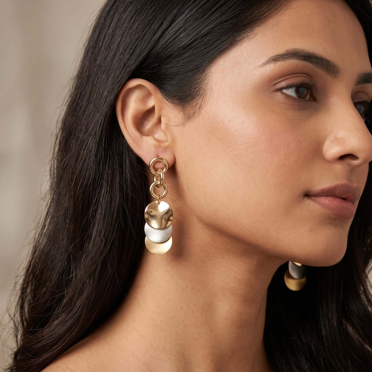 Gold Rosegold Silver Dangler earrings showcased on a model, featuring elegant alloy and stainless-steel materials.