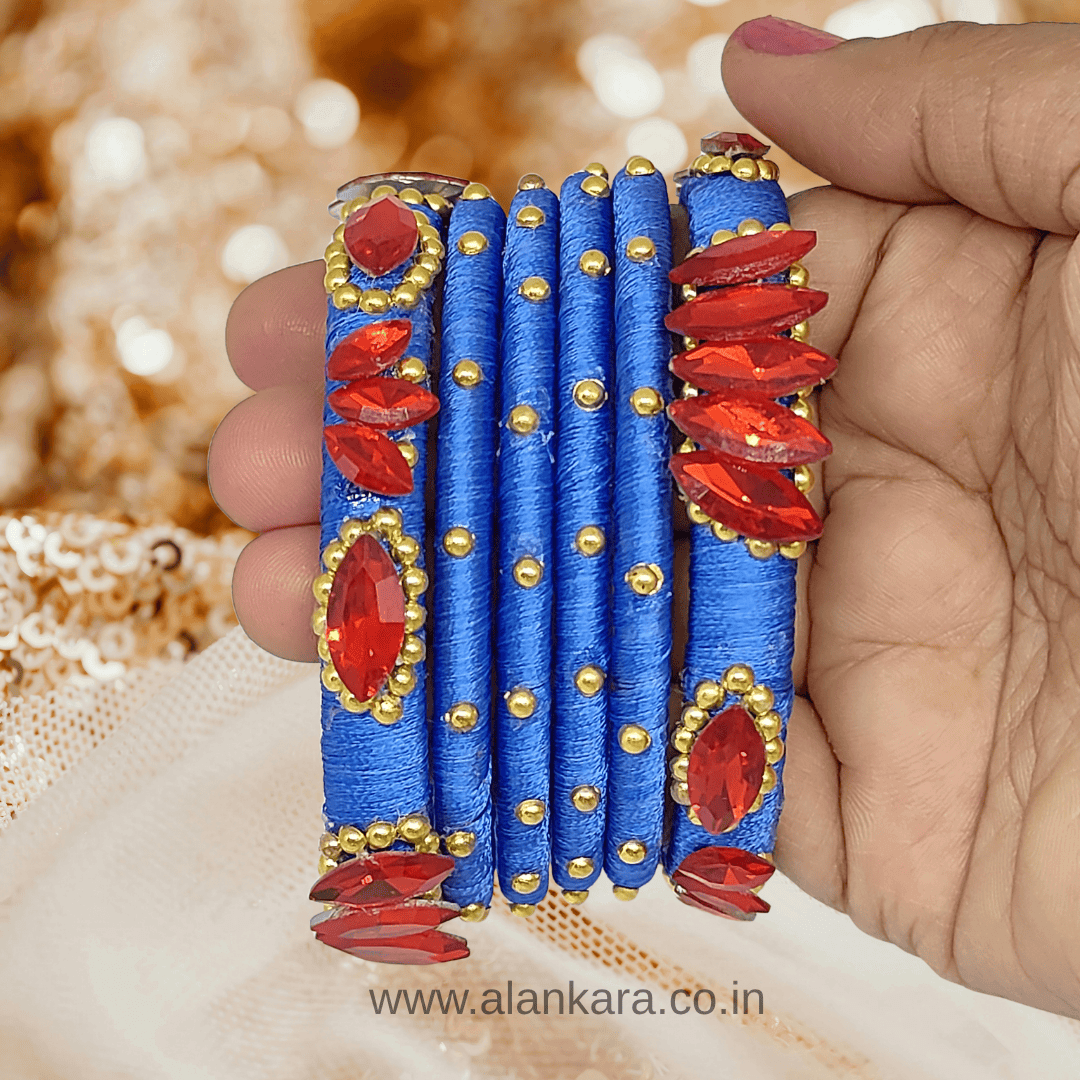 Royal Blue Red crystal silk thread bangles featuring red crystals and golden beads, perfect for festive occasions.