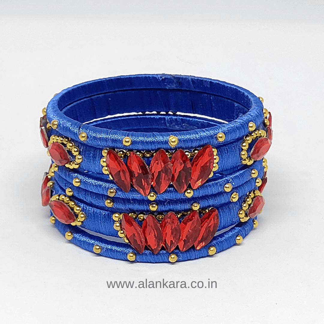 Royal Blue Red crystal silk thread bangles featuring red crystals and golden bead detailing.