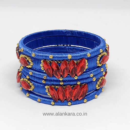 Royal Blue Red crystal silk thread bangles featuring red crystals and golden bead detailing.