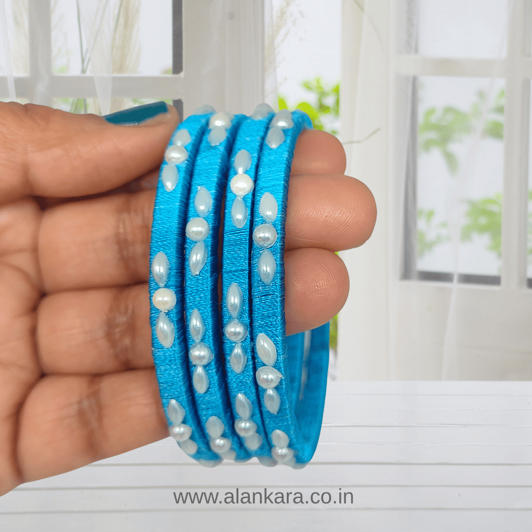 Blue Pearl Silk Thread Bangles in vibrant sky blue with white pearl detailing, handcrafted for elegant traditional style.