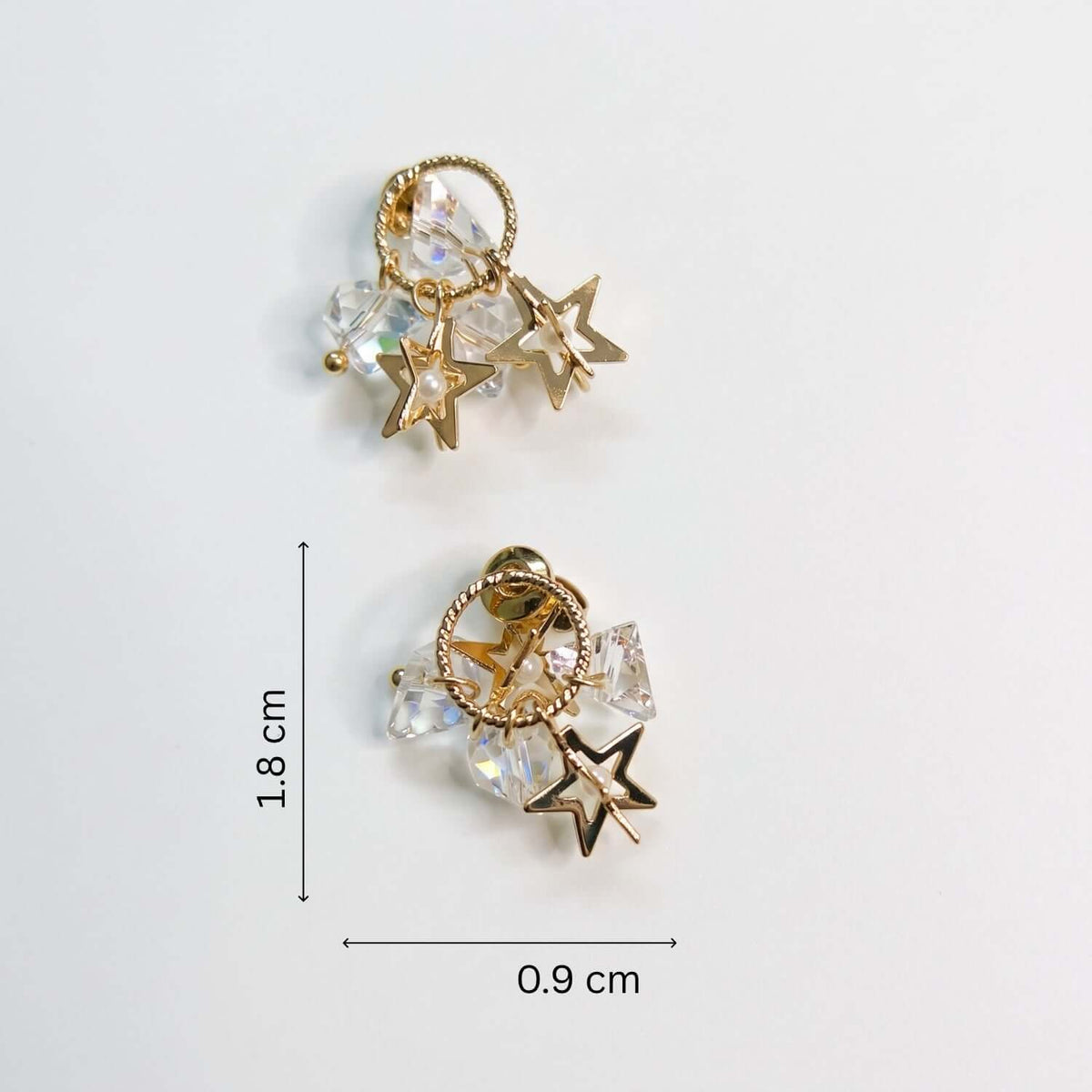 White Crystal Star Stud earrings featuring a golden design with sparkling white crystals, dimensions 0.9 cm x 1.8 cm.