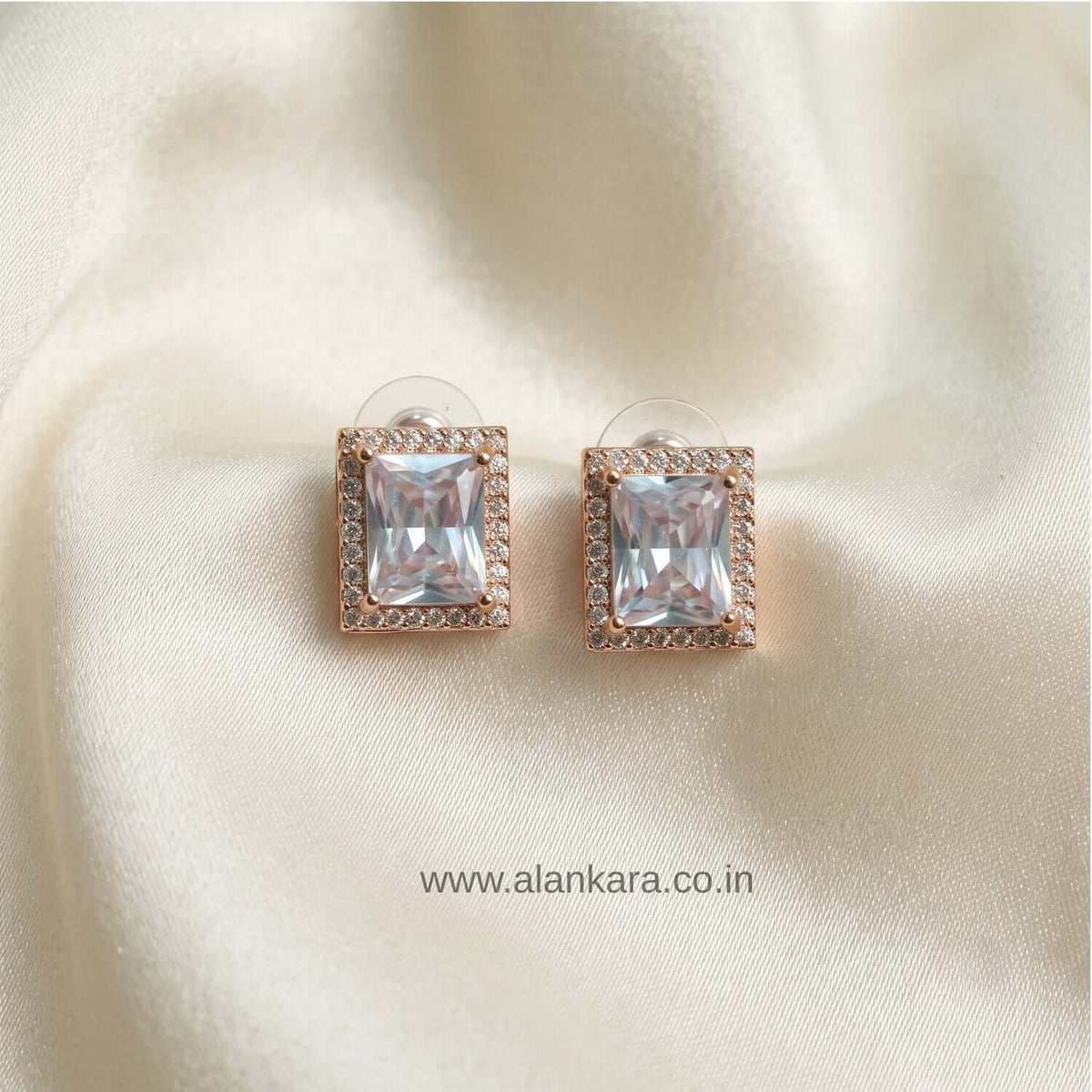 White Crystal Stud earrings featuring cubic zirconia in a rose gold plated setting.