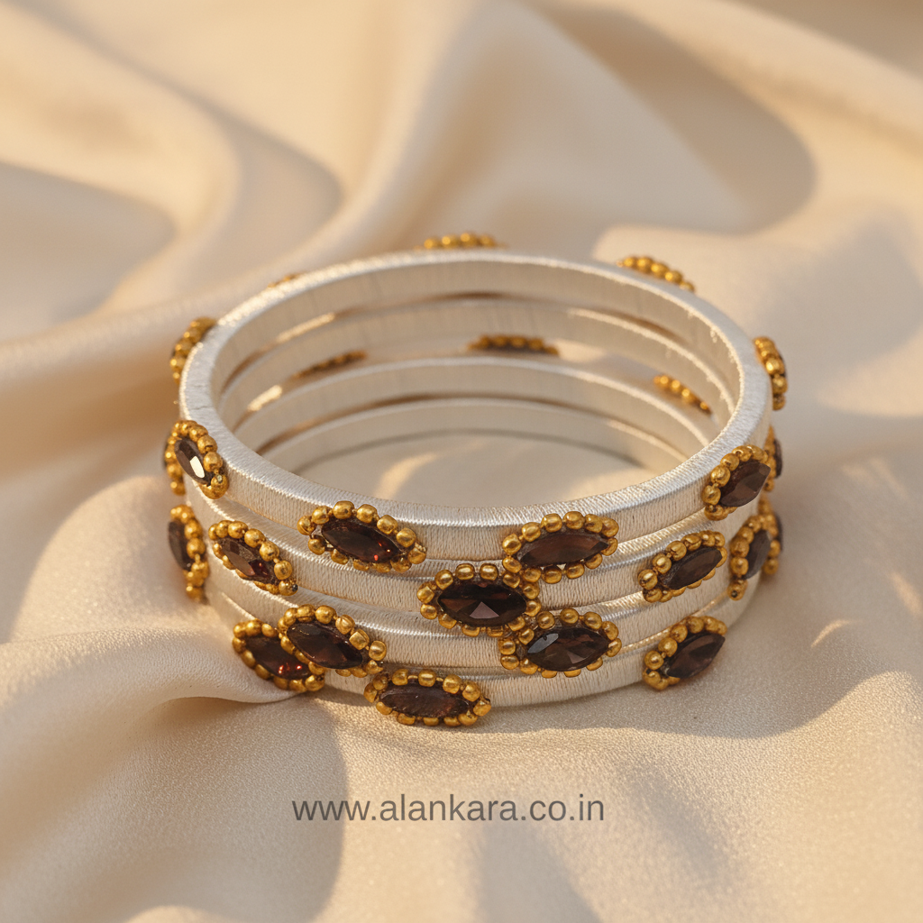 white wine silk thread bangles on beige fabric background