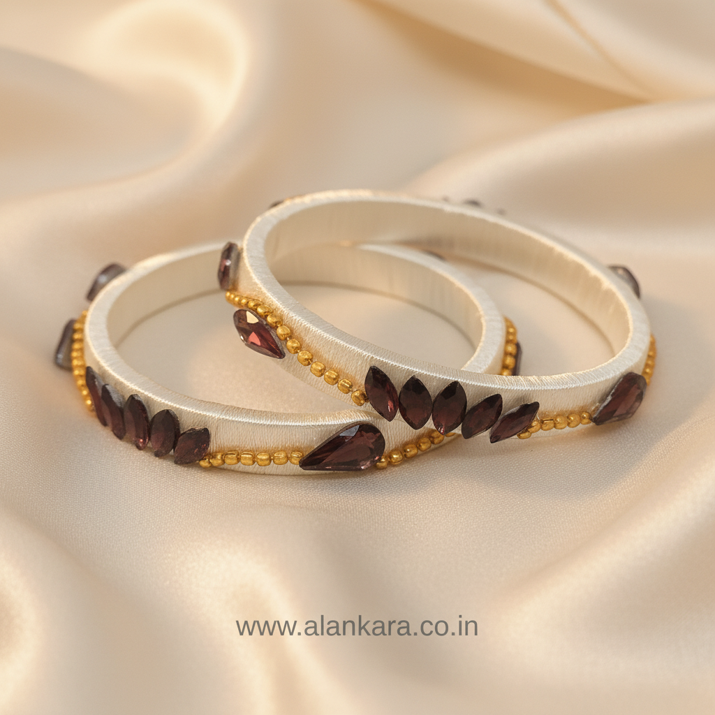 White Wine Lotus Silk Thread Kada Bangles adorned with wine marquise crystals and golden beads on soft fabric.