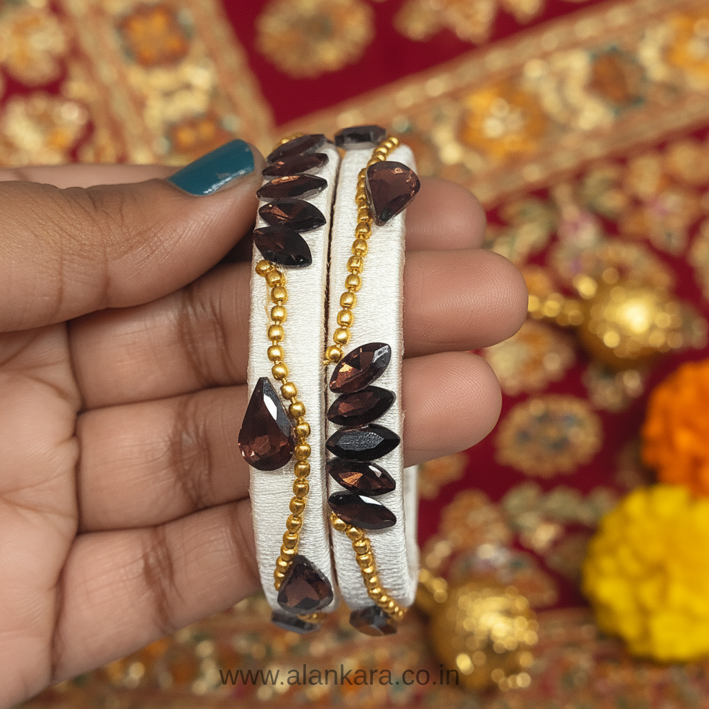 White Wine Lotus Silk Thread Kada Bangles with marquise crystals and golden beads in hand.
