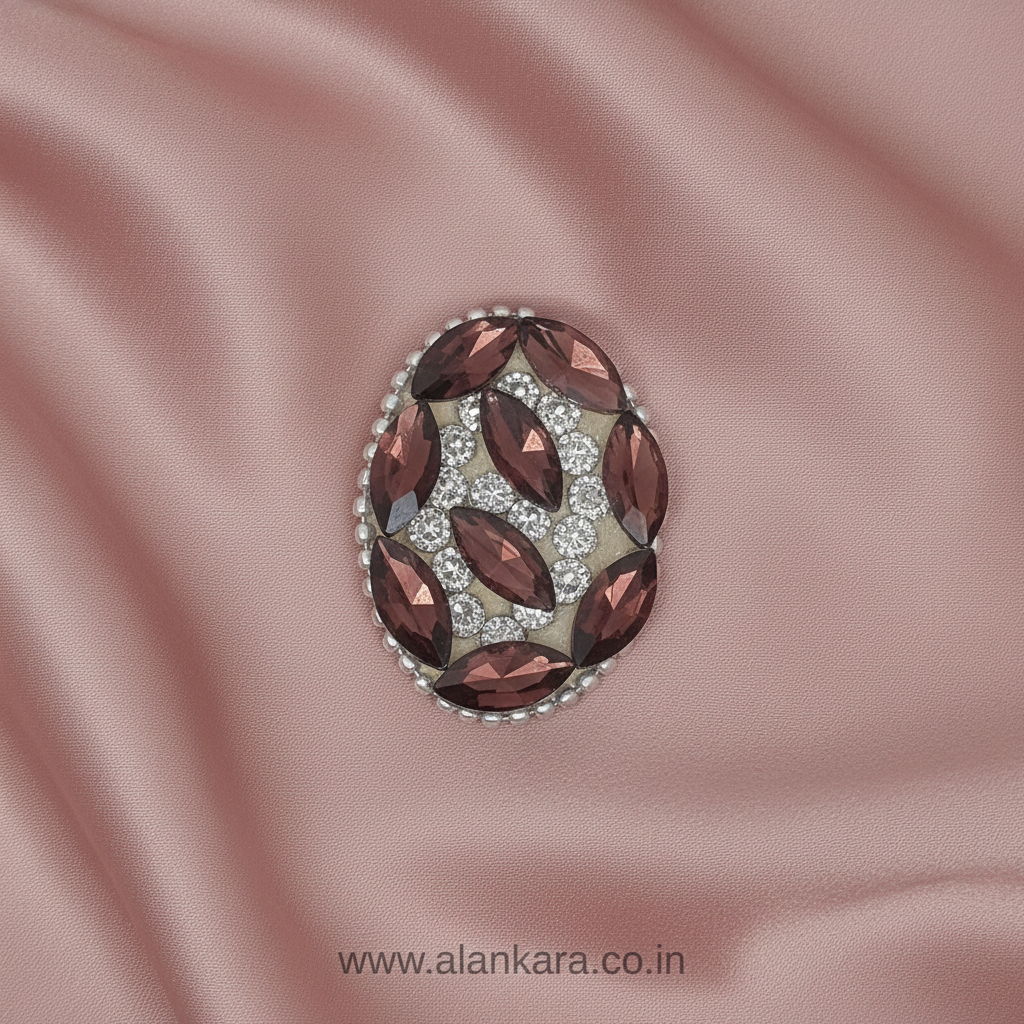 Wine Crystal Noori Saree Pin featuring rich wine-colored crystals and sparkling noori stones on soft pink satin fabric.