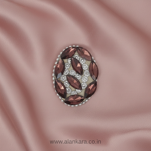 Wine Crystal Noori Saree Pin featuring rich wine-colored crystals and sparkling noori stones on soft pink satin fabric.