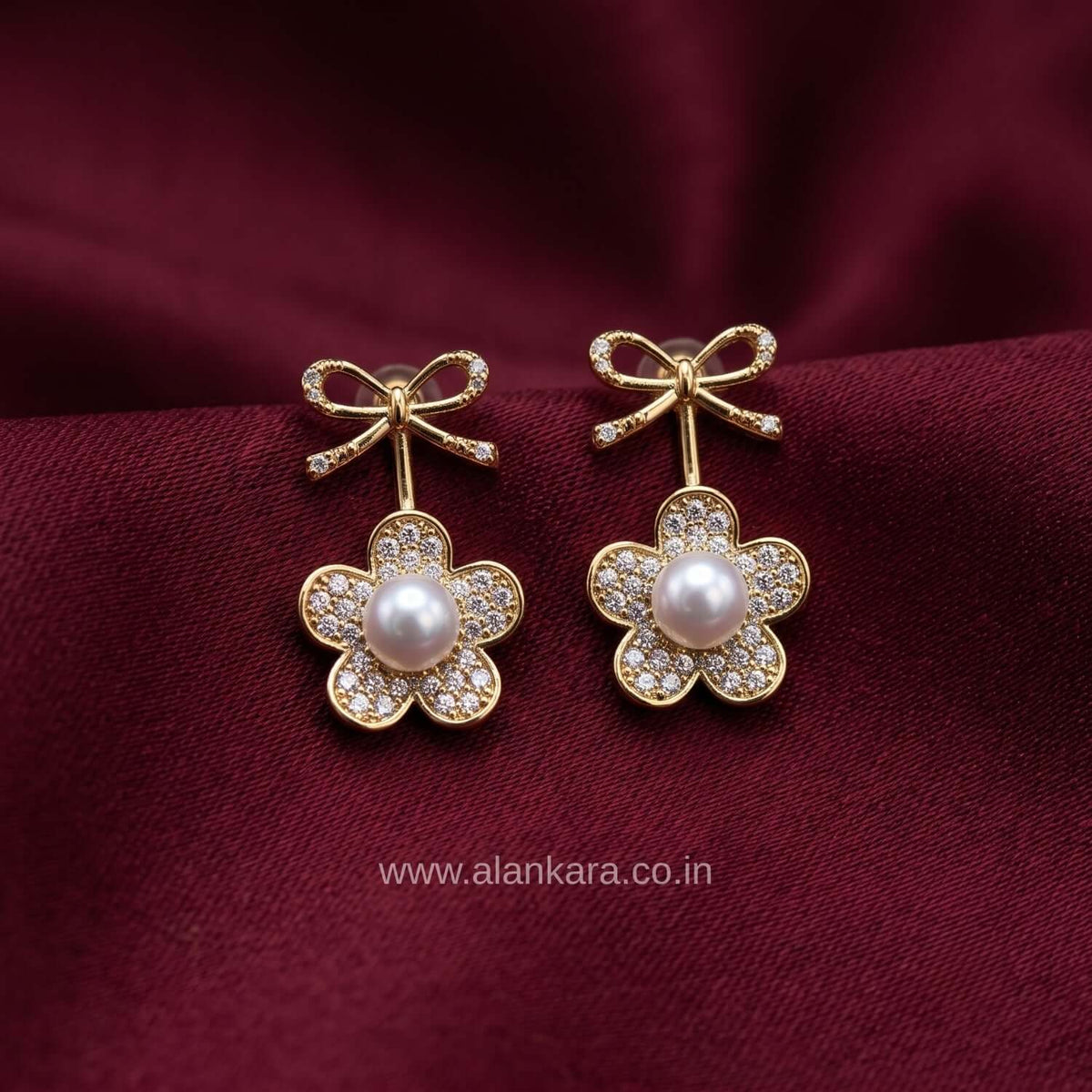 White Pearl Bow Stud earring featuring gold plating and sparkling cubic zirconia, perfect for any outfit.