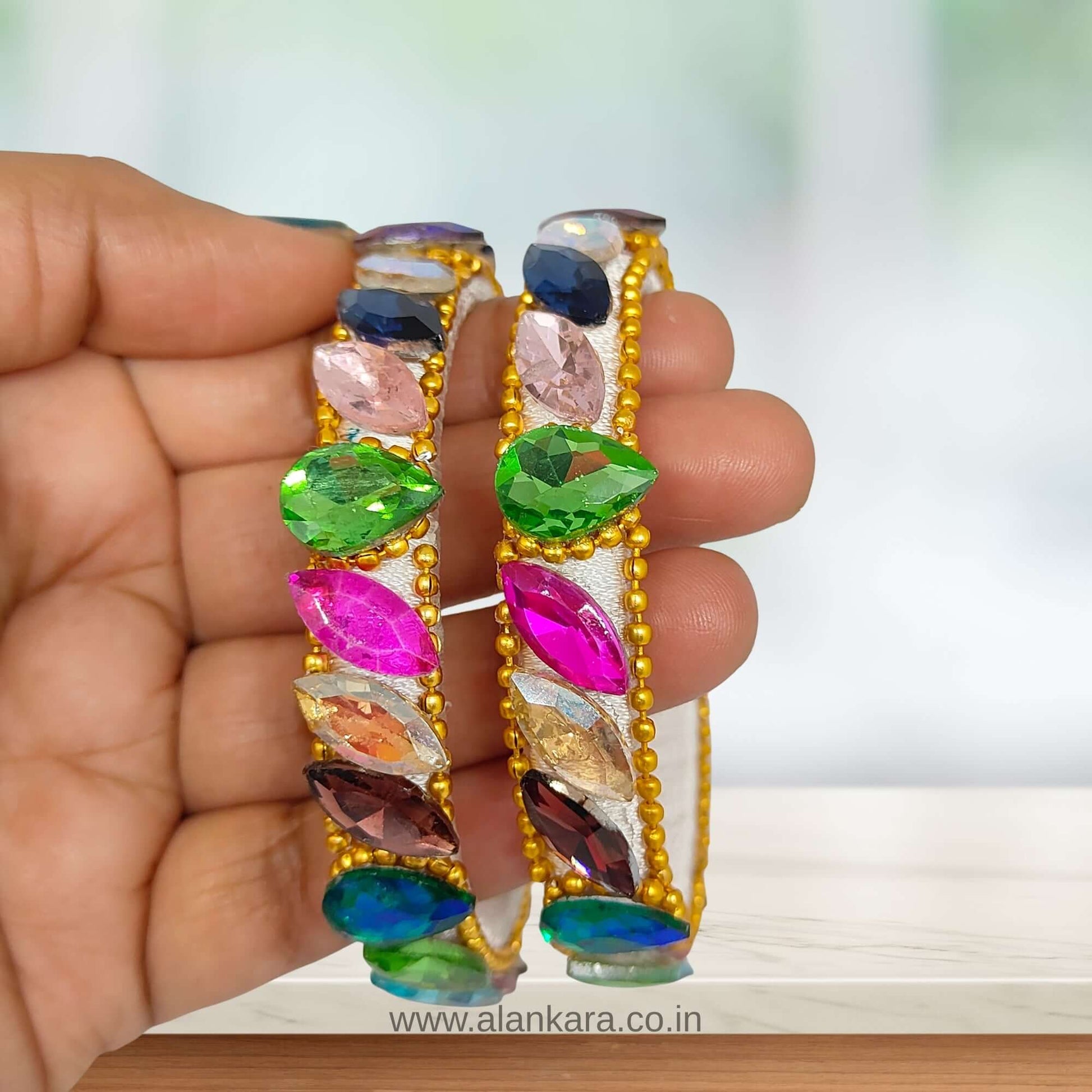 Multicolor White Silk Thread Kada Bangles featuring colorful crystals and golden bead detailing.