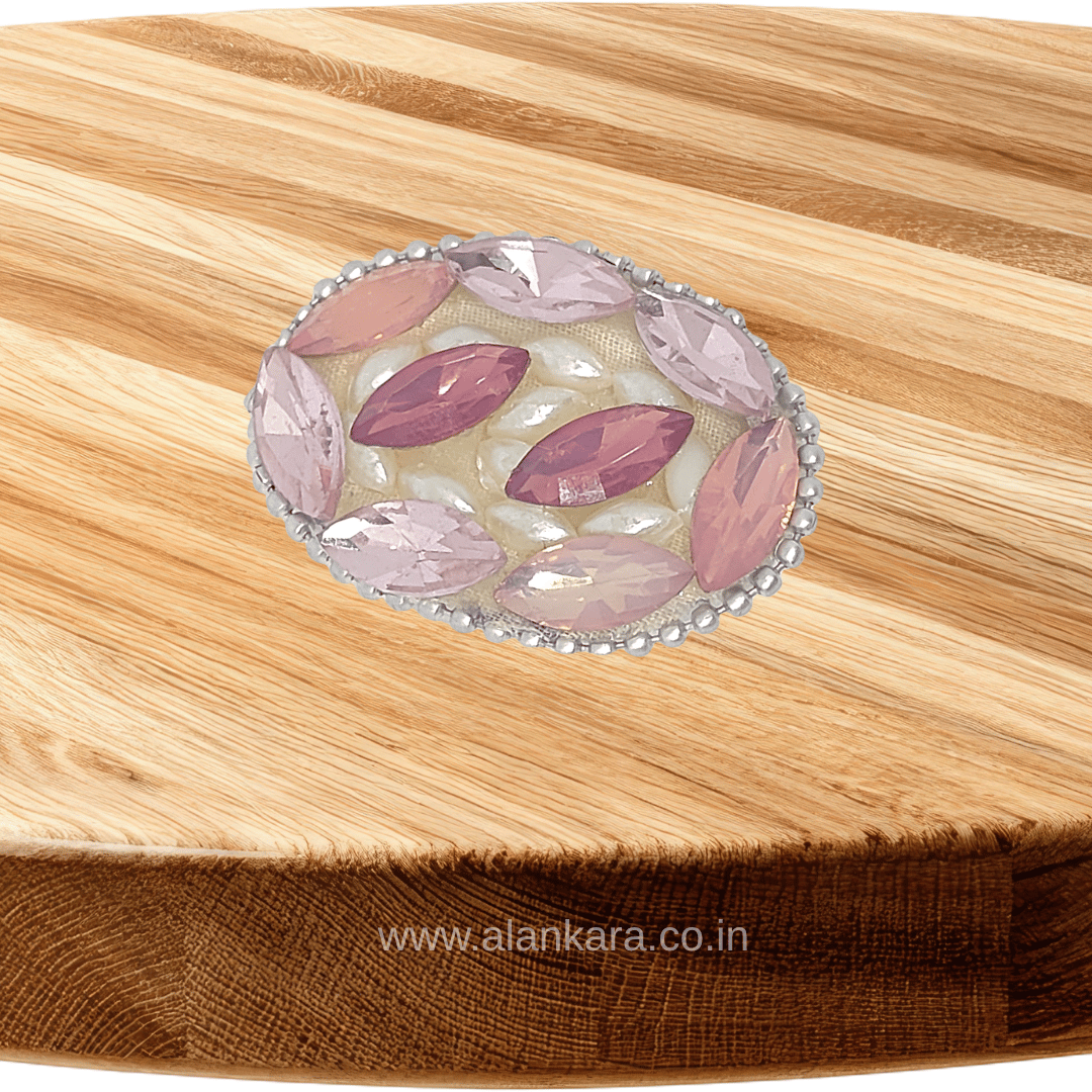 Blush Pink Crystal Pearl Saree Pin featuring sparkling crystals and pearls on a wooden background.
