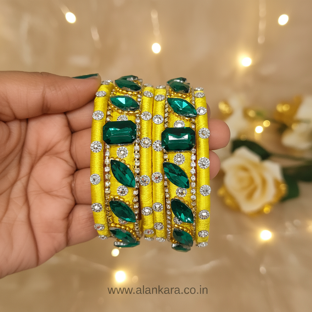 Yellow & Green Noori Silk Thread Bangles with green crystals and American diamond stones, perfect for festive celebrations.