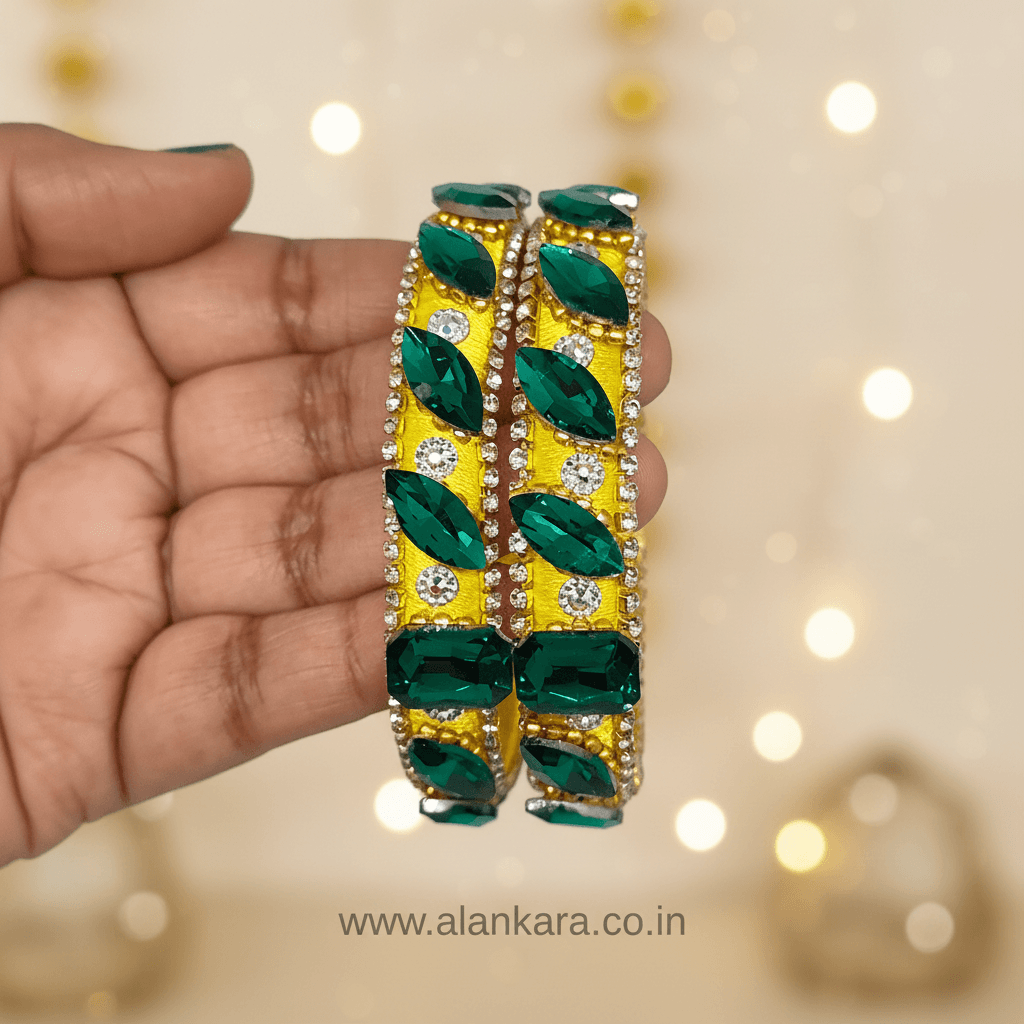 Yellow & Green Noori Silk Thread Kada Bangles adorned with emerald stones and crystals.