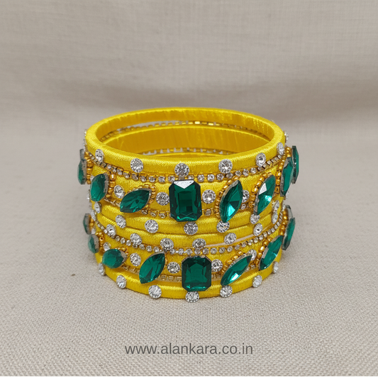 Yellow & Green Noori Silk Thread Bangles embellished with sparkling crystals and American diamonds.